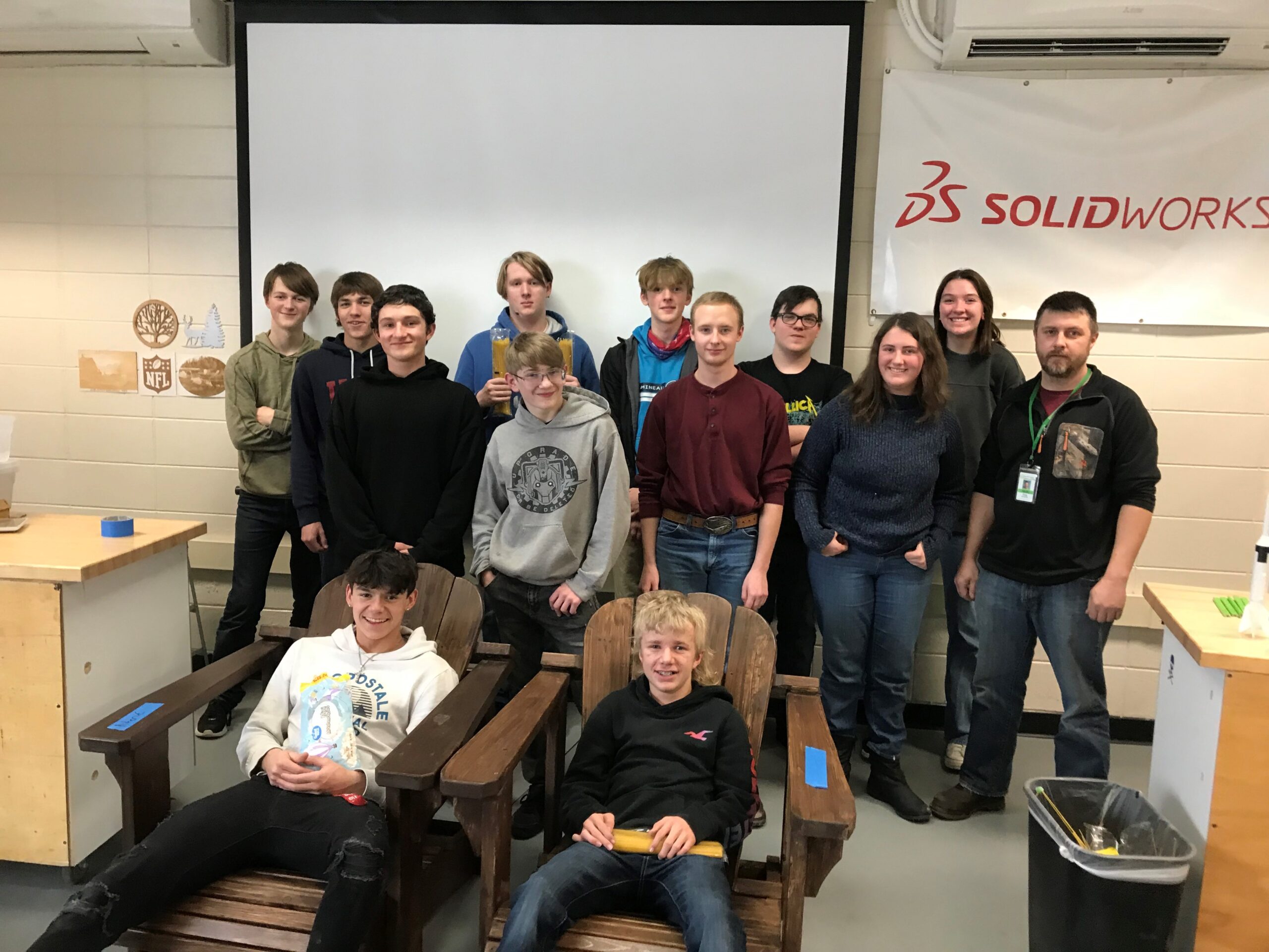 Grantsburg high school engineering students group photo in a shop class room